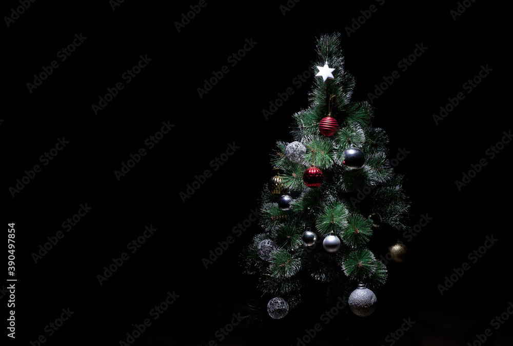decorated christmas tree on a black background decorated christmas tree on a black background