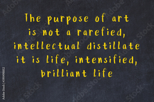 Chalk inscription of smart quote on black desk