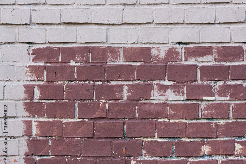 Obraz premium Old painted brick wall. Texture of rough brickwork. Masonry background.
