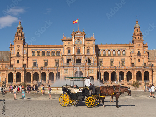 Horse carriage with tourists in the Plaza de españa in Seville