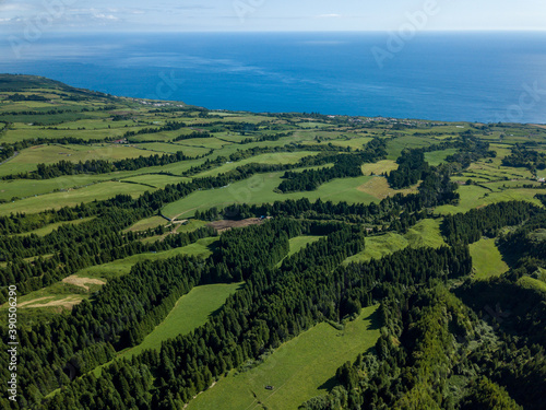 Landscape view over the luxurious green landscape with the Atlantic Ocean in the background. S  o Miguel Island. Azores.