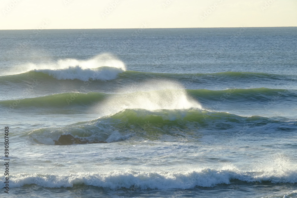 Fototapeta premium Some big waves breaking in a sunny day during a perfect day at la govelle, a surf spot located in the west of France.