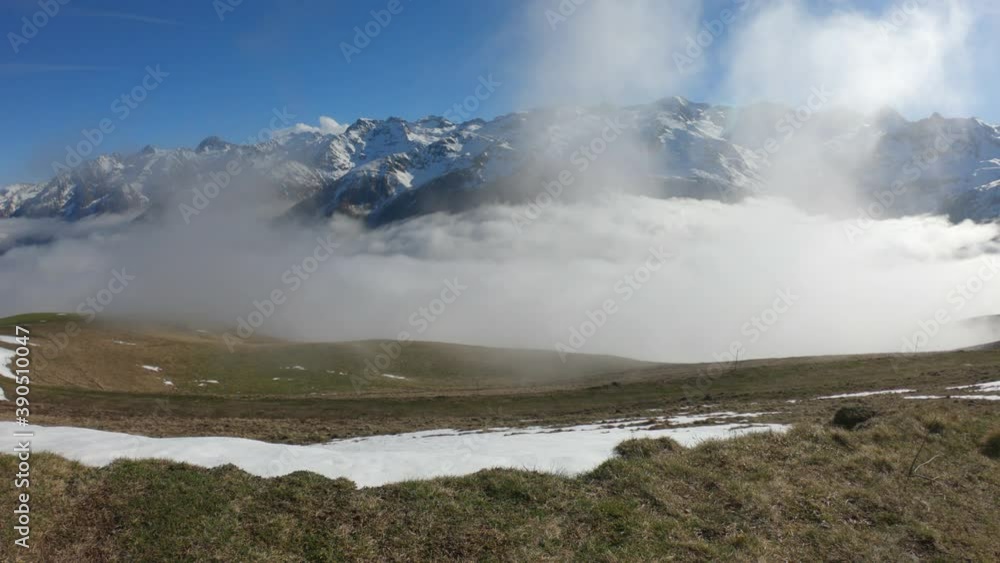 SLOW MOTION SHOT - Snow and mountain peaks in the french Pyrenees near the Luchon Superbagnères Ski Resort in the Arrondissement of Saint-Gaudens, Occitania, Haute-Garonne, France. SLOW MOTION SHOT - Snow and mountain peaks in the french Pyrenees near the Luchon Superbagnères Ski Resort in the Arrondissement of Saint-Gaudens, Occitania, Haute-Garonne, France.