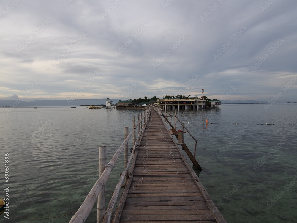 A long wooden bridge leading to the island, Marine Sanctuary, Nalusuan Island, Cebu, Philippines