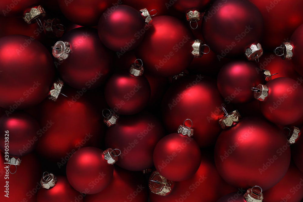 Christmas decorations, top view of pile of glass balls colored in red, useful as a greeting gift card background Christmas decorations, top view of pile of glass balls colored in red, useful as a greeting gift card background