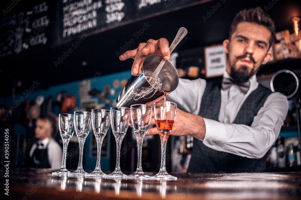 Bartender mixes a cocktail in the porterhouse