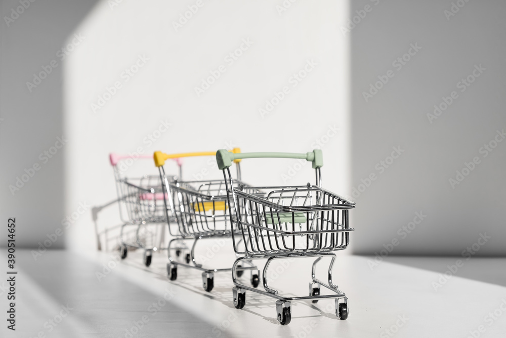 Shopping carts isolated on white background. Safe online shopping on quarantine concept. Empty supermarket shopping trolleys with copy space. Social distance concept