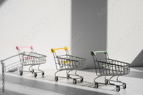 Shopping carts isolated on white background. Safe online shopping on quarantine concept. Empty supermarket shopping trolleys with copy space. Social distance concept © Николай Амосеев