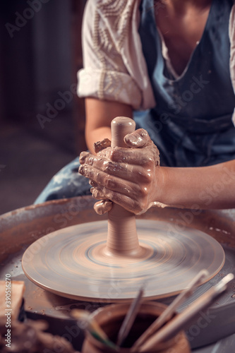 The hands of the master who makes the jug. Close-up. photo