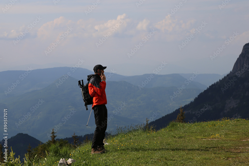 Man talking on phone in mountain