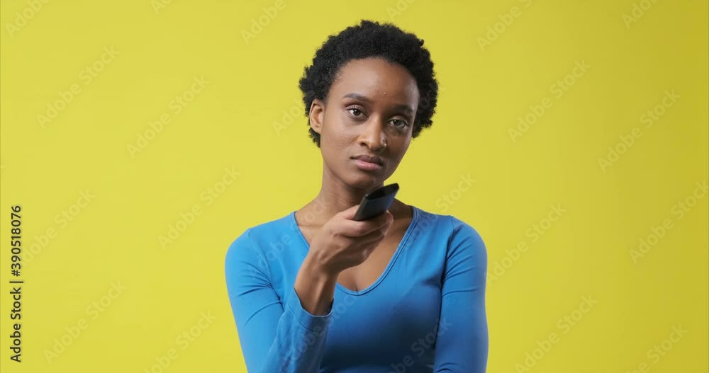 Bored woman changing channel and watching tv on finding her favourite program Bored woman changing channel and watching tv on finding her favourite program