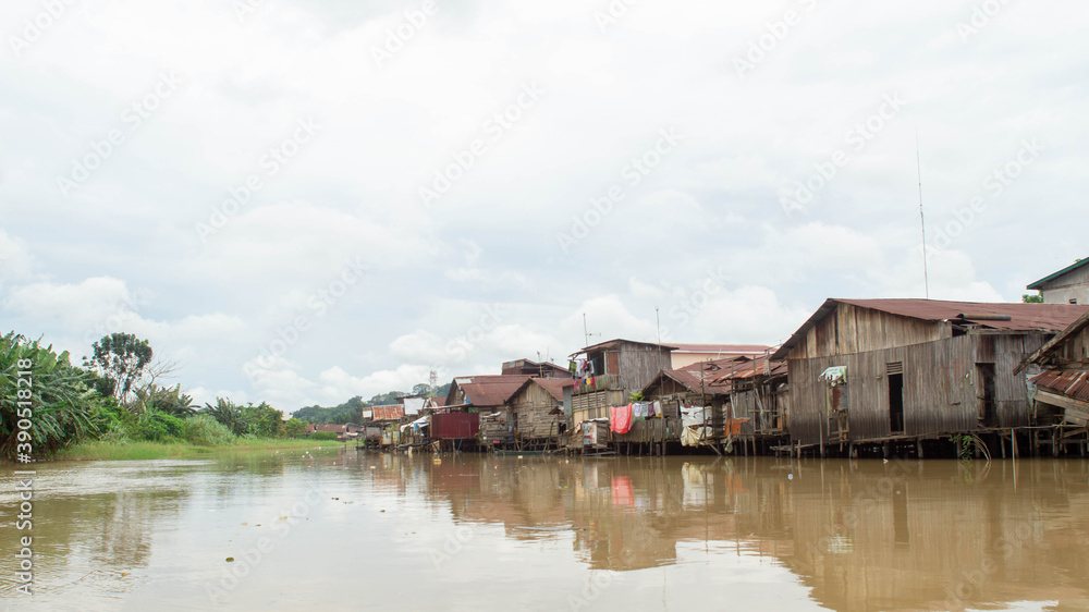 Wooden house on Karang Mumus Riverbank. Slum area on Karang Mumus river, Samarinda, Indonesia