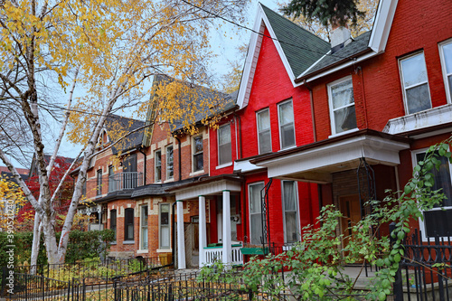 Photography Street with narrow Victorian row houses with gables