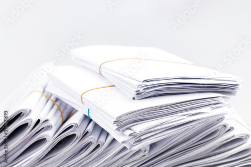 close up paper documents stack at workplace. paperwork concept. studio shot. blank