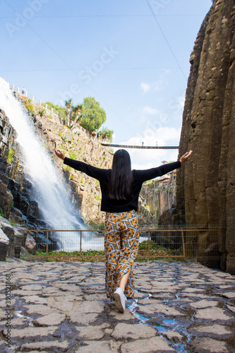 Young woman at beautiful canyon landscape