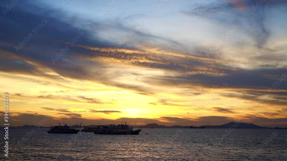 Silhouette of passenger boat moored at sea with dramatic sunset sky background Silhouette of passenger boat moored at sea with dramatic sunset sky background