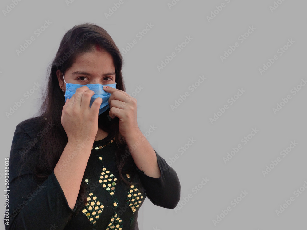 Wear face mask Properly , Woman pressing medical face mask for good fitting on face. Wear face mask Properly , Woman pressing medical face mask for good fitting on face.