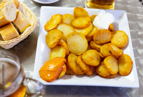 Appetizing Patatas Bravas - traditional Spanish potato snack or Tapas