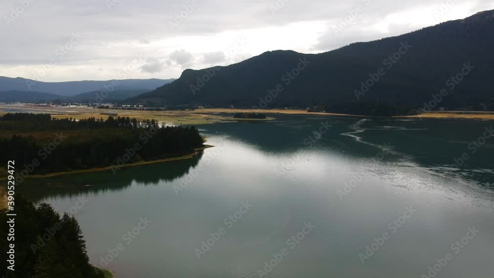 Alaska Lake. Serene Nature View with Silhouette of Trees & Mountains. Alaska Lake. Serene Nature View with Silhouette of Trees & Mountains.