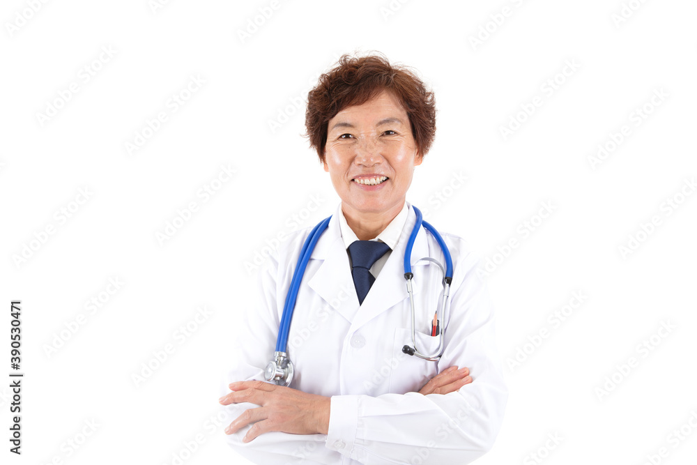 Experienced female doctor looking at camera smiling in front of white background Experienced female doctor looking at camera smiling in front of white background