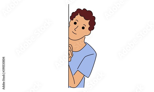 Boy hides behind the wall