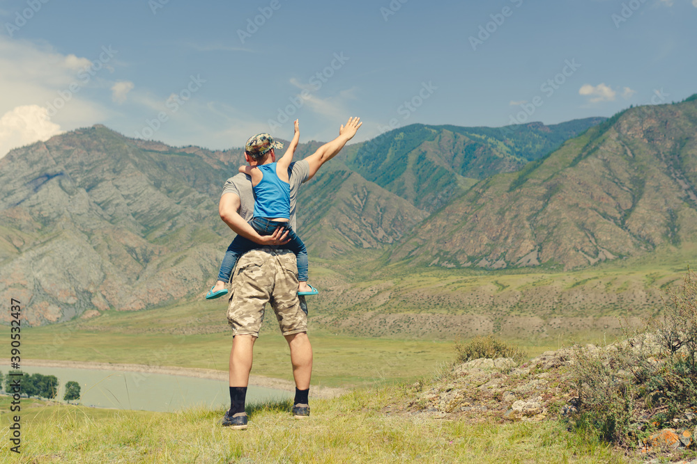 Father and son on the top of mountain