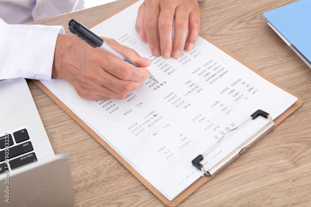 Doctors in white coats are signing relevant documents Doctors in white coats are signing relevant documents
