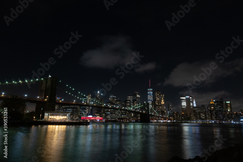 Brooklyn bridge at night form the park  