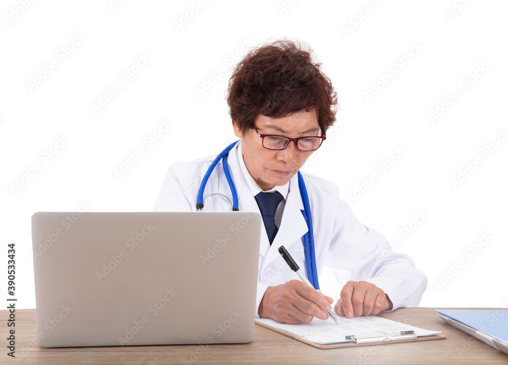 Chinese female doctor sitting at the desk is working Chinese female doctor sitting at the desk is working