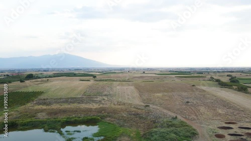 Forward moving 4K clip over the countryside and vineyards in close to the village Choristi, in Drama, Greece photo