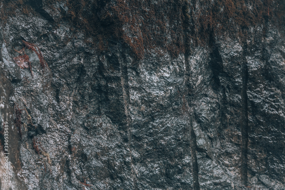 Gray rock. A cut of a stone rock with traces of stone processing Gray rock. A cut of a stone rock with traces of stone processing