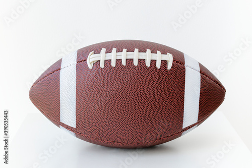 Leather American football ball on white background photo