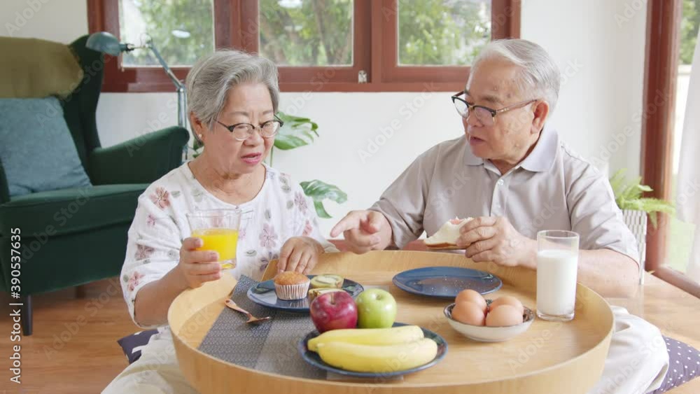 Asian senior couple having breakfast with healthy food at home, happy lifestyle of retirement people Asian senior couple having breakfast with healthy food at home, happy lifestyle of retirement people
