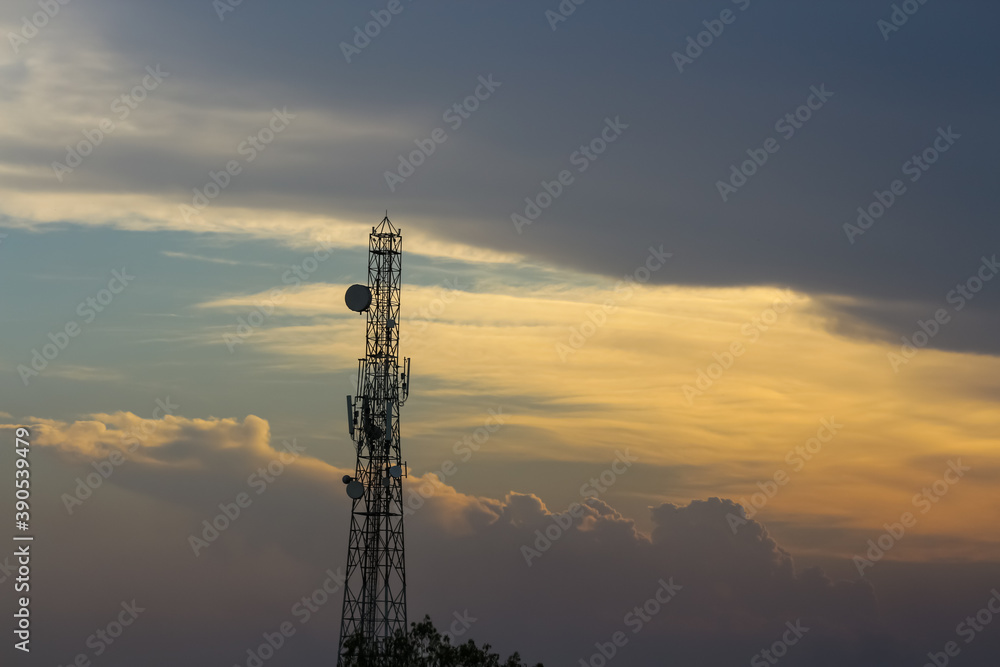 An evening view of the cloudy sky and a communication tower
