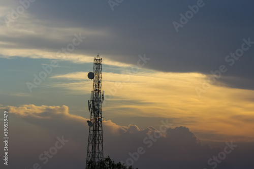 An evening view of the cloudy sky and a communication tower