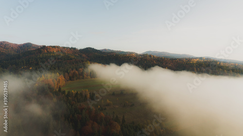 Obraz na płótnie Landscape with fog and hills on an epic autumn morning w salonie