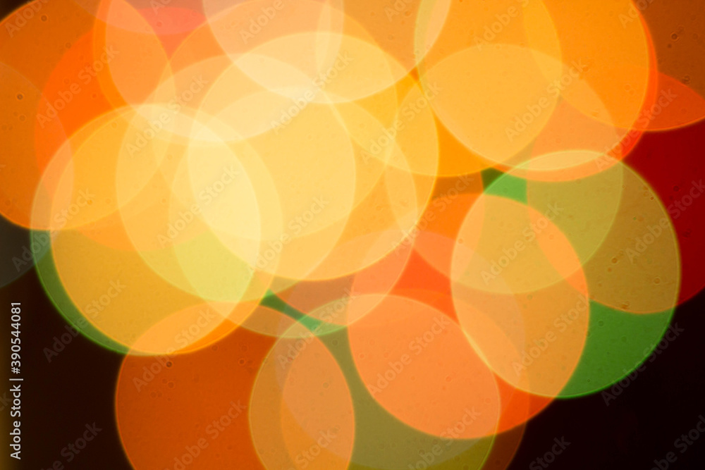Blurred multicolored lights on a dark background. Blurred multicolored lights on a dark background.