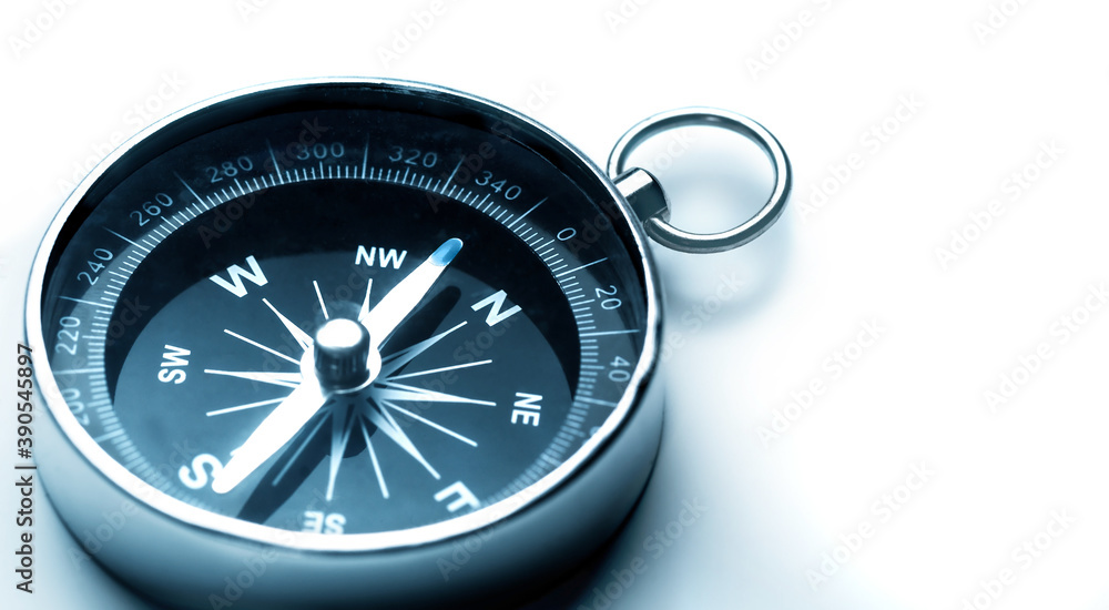 Metal Navigational Compass on a white Metal Navigational Compass on a white