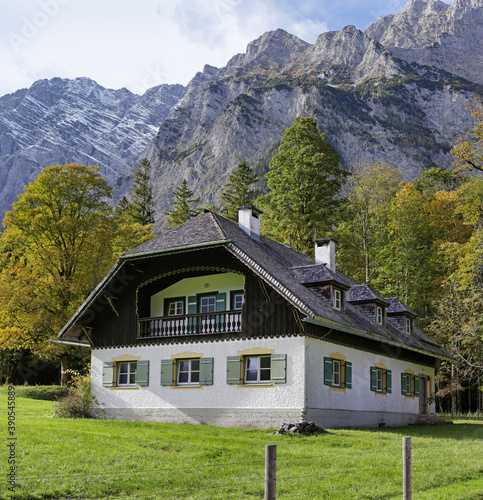 Wooden house in the alpine village. © alexsvirid