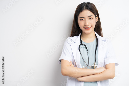 portrait asian female doctor smiling on white background
