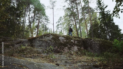 young caucasian man in the wild forest or park in Imatra, Finland photo