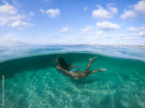 Woman diving into the sea.