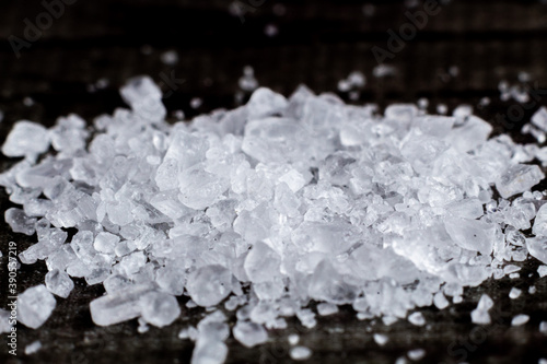 Macro photograph of salt, a close-up of salt on a dark background photo