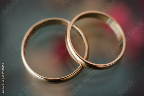 two traditional wedding gold engagement rings close-up