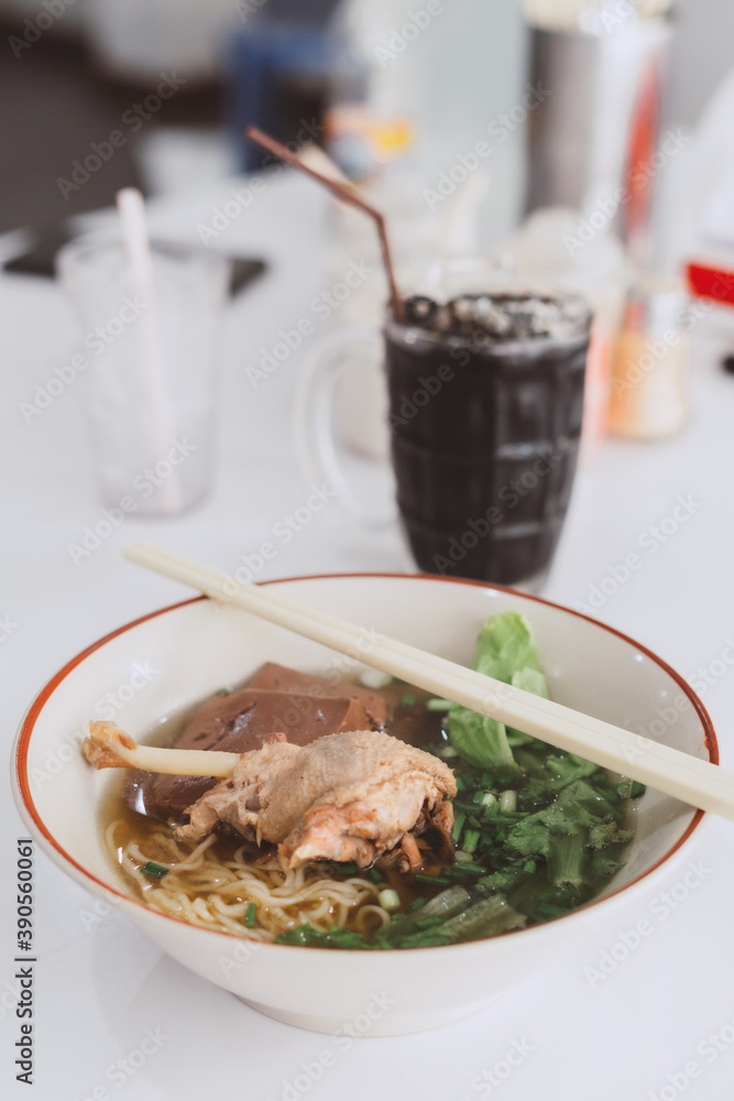 Braised duck leg noodles in a spiced broth served with tofu, pork blood and lettuce this is delicious local cuisine food of Thailand or Asia region, Street food in Thailand Braised duck leg noodles in a spiced broth served with tofu, pork blood and lettuce this is delicious local cuisine food of Thailand or Asia region, Street food in Thailand
