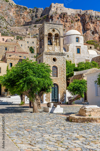 Fototapeta Naklejka Na Ścianę i Meble -  Traditional architecture with the  bell tower of Elcomenos Christos in the main square  of the medieval  castle of Monemvasia, Lakonia, Peloponnese, Greece