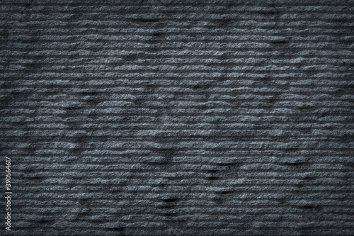 Dark grey black slate stone with groove texture abstract background