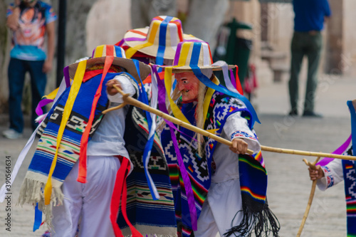 Traditional dance of the old men in the main square of Morelia, Mexico photo