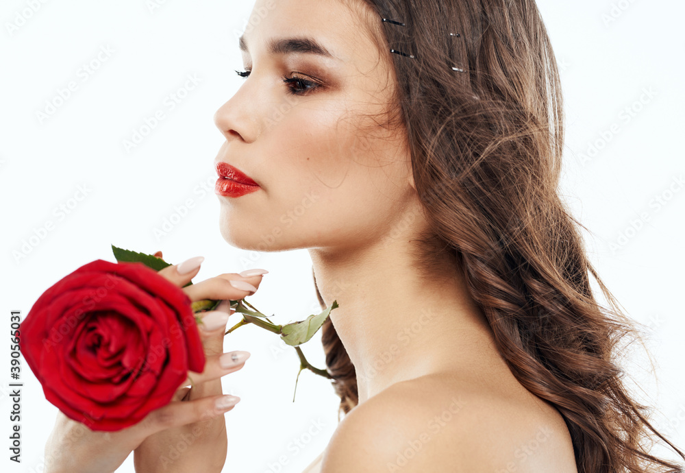 Attractive people with a red flower on the shoulder, naked neck and bright makeup