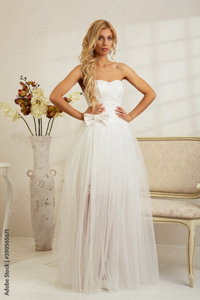 Bride in a luxury apartment in a wedding dress. Bride in a luxury apartment in a wedding dress.